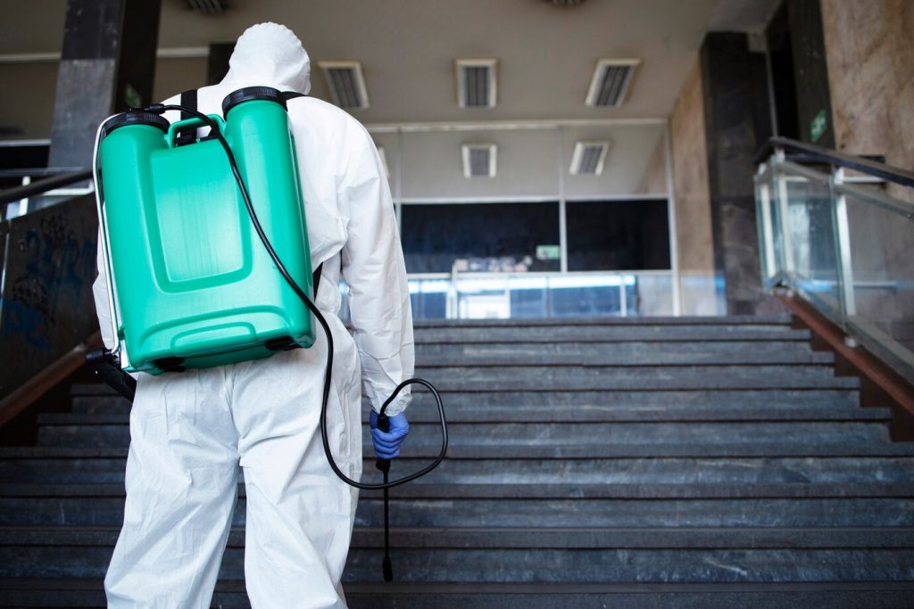 این تصویر دارای صفت خالی alt است؛ نام پروندهٔ آن unrecognizable-person-white-chemical-protection-suit-with-reservoir-disinfecting-public-corridor-stop-spreading-highly-contagious-corona-virus_342744-867-1024x683.jpg است